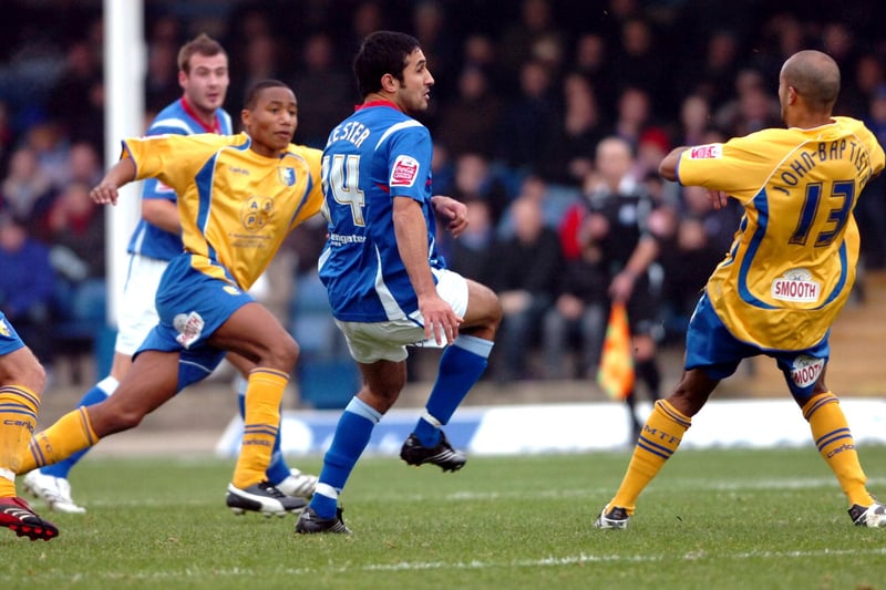 Jack Lester passes the ball as Jon D'Laryea and Alex Baptiste try to put him under pressure.