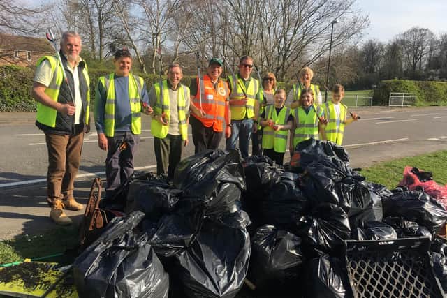 Simon Parker (centre - in orange) on a litter pick with Hollingwood residents as part of the annual Great British Spring Clean event.