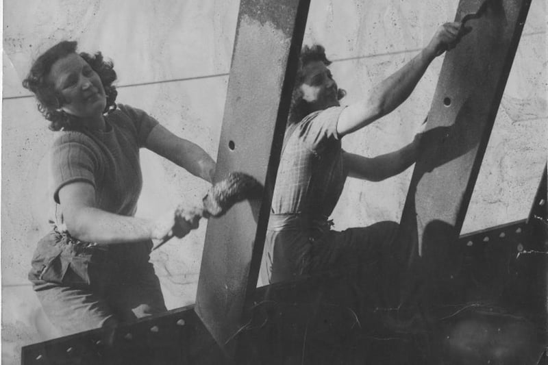 Two women painting a ship in the shipyards during the Second World War. Photo: Hartlepool Museum Service.