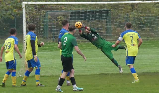 Action from the game between Tupton (yellow/blue) and Creswell Barnett Reserves, which Creswell won 2-1. All photos by Martin Roberts.