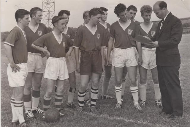 A group of boys take part in pre-season trials for Chesterfield Football Club. The picture shows Chesterfield Manager Tony McShane (right) chatting with some of the boys at the trials.