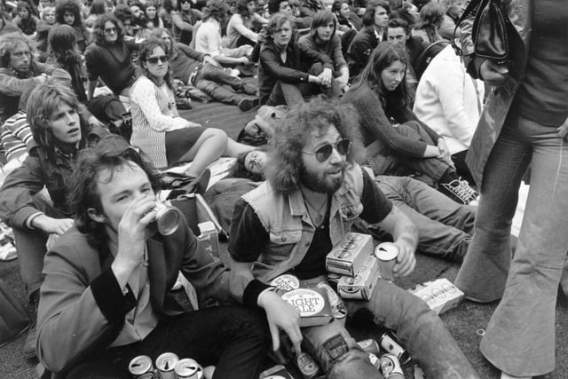 7th August 1972:  Fans during an interval in the Isle of Wight pop festival.  (Photo by John Minihan/Evening Standard/Getty Images)