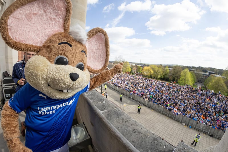 Chester the Fieldmouse waves to the crowd