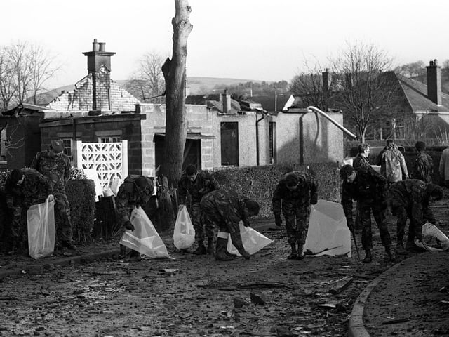 Some of the Gordon Highlanders brought in to help search for more of the wrecked Pan Am jumbo jet, scouring Sherwood Crescent, the road most devastated by the Boeing 747 which crashed on Lockerbie. Eleven local people are believed to have died in their homes.