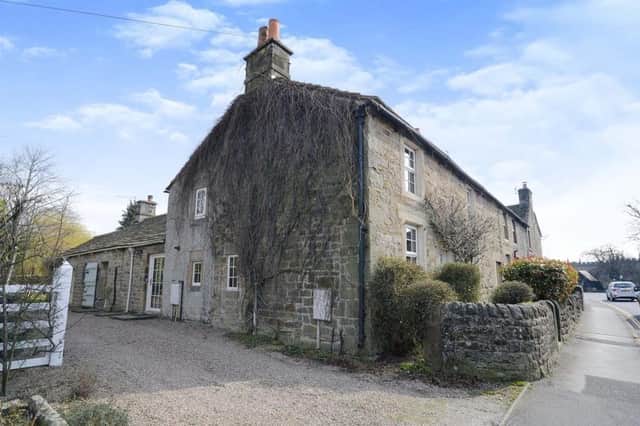 The stone-built cottage is on the end of a terrace at Calver Road, Baslow.