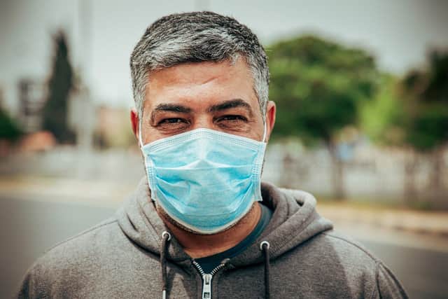 Health chiefs say mask wearing and social distancing are likely to be with us for several months yet