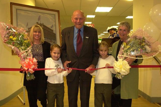 The relaunching of the extended and revamped atkinson store on the Moor was done by chairman Peter Atkinson, his granchildren , Rebecca Atkinson, 7 and Hannah Atkinson, 9, right. Watched by the companies long running employee's Sharon Willers, left from Darnall and Joyce Marples from Frecheville who have both worked for 25 years. 