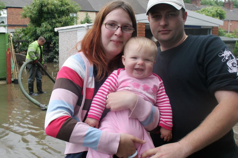 Anne Squires with baby Arwen and rescue hero Paul Gilbert , at Tapton Terrace in Chesterfield, on June 26, 2007, when flash flooding hit the area.