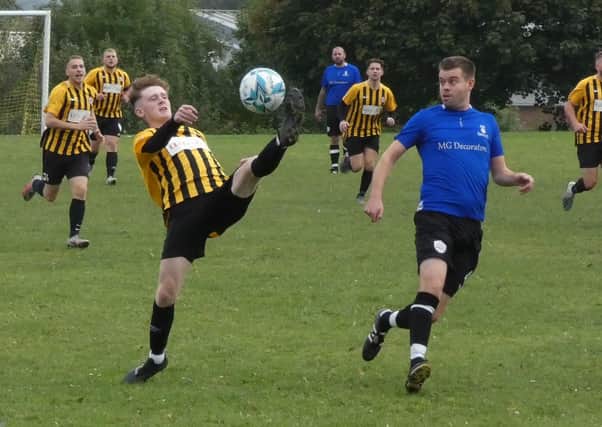 Action from New Tupton's 4-2 win.