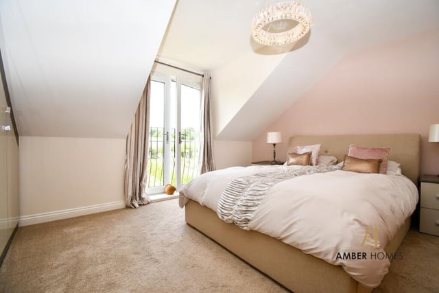 All four double bedrooms are located on the second floor of the £450,000 property, including this master, which features en suite facilities and a mini-balcony overlooking the back garden