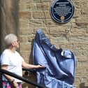 Marlene Cook, believed to be the longest-serving member of the current congregation, unveils the plaque aided by church secretary Margaret Davies.