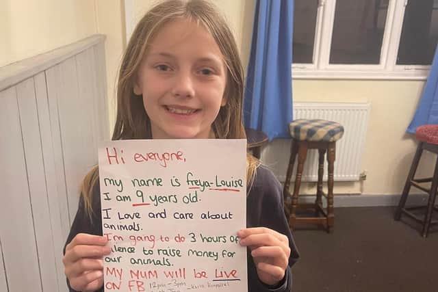 Freya-Louise Korpalski with the poster she made to encourage people to support her three-hour sponsored silence.