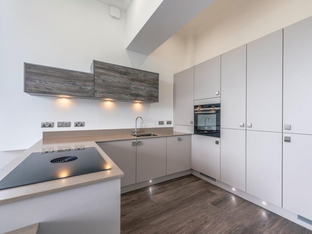 The modern Brooklyn kitchens have appliances by Siemens.