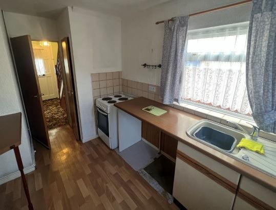 Modernisation would turn this two-bedroom house at Hucklow Avenue into a lovely home for a couple or a young family.