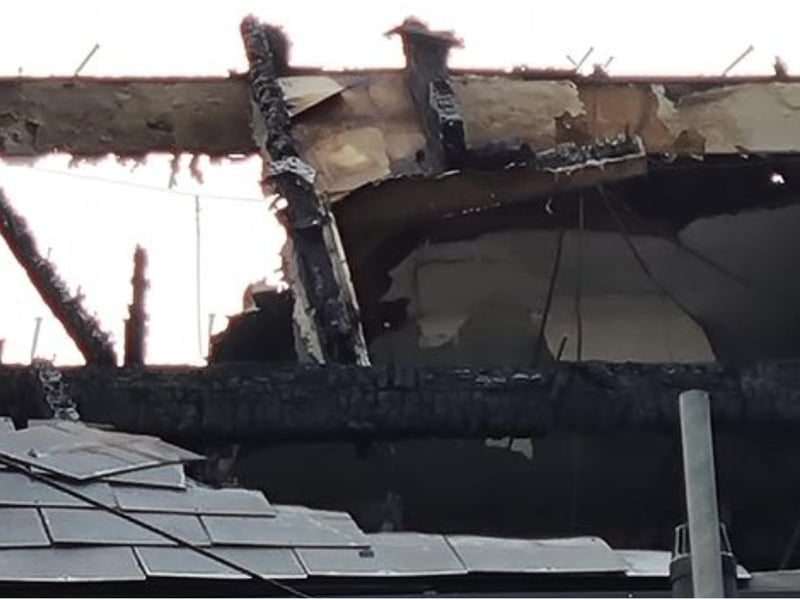 The blaze started in a roof at one of the properties.