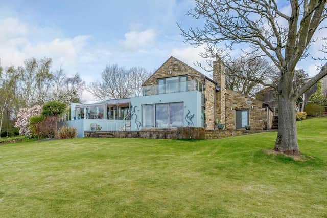 The property, for sale at £1.4m is ultra-modern, but designed to 'blend seamlessly' with the nature around it.