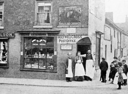 This business was on the corner of Cavendish Street and Holywell Street.  Above the post office sign is a board for Glossop's Livery Store advertising horses and carriages.