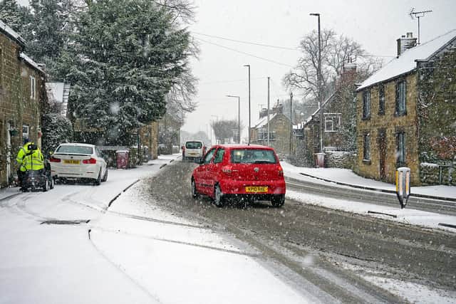 Snow falling on the A61 in Derbyshire this January. Heavy snow showers are forecast for tomorrow.