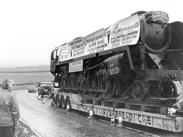 Loco no. 92214 nears the end of its six day journey from a scrapyard in South Wales to Peak Rail's base at Buxton's Midland Station in 1980