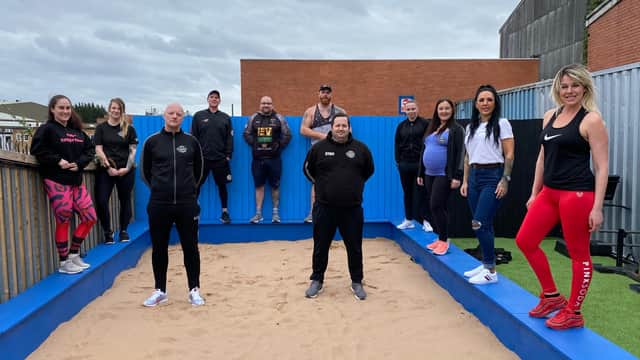 Paul Holmes, pictured centre left, and the team in the outdoor training space at Full Power Fitness in Heanor.