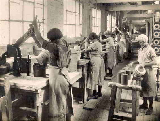 Workers at Pearsons Pottery in the 1920s use jolleying machines to produce jam jars.