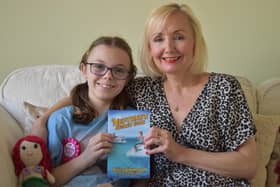 Genna Rowbotham with her daughter Holly who inspired her latest children's book, Neptune's Secret Code.
