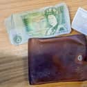The brown wallet contained a one-pound note, stamps worth 18p and receipts from 1987.