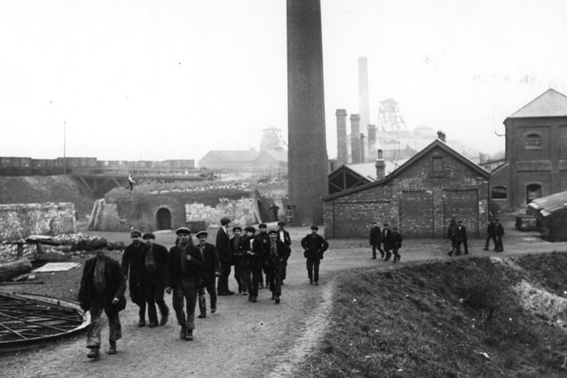A group of coal miners leaving the mine in Derbyshire on 1 February 1912:    (Photo by Topical Press Agency/Getty Images)