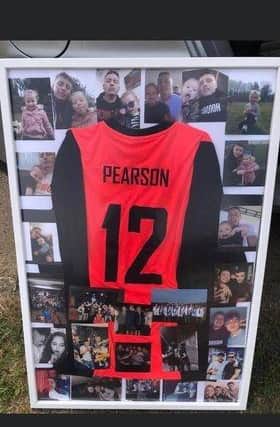 One of Billy's friends has created a board with his football top and photos.