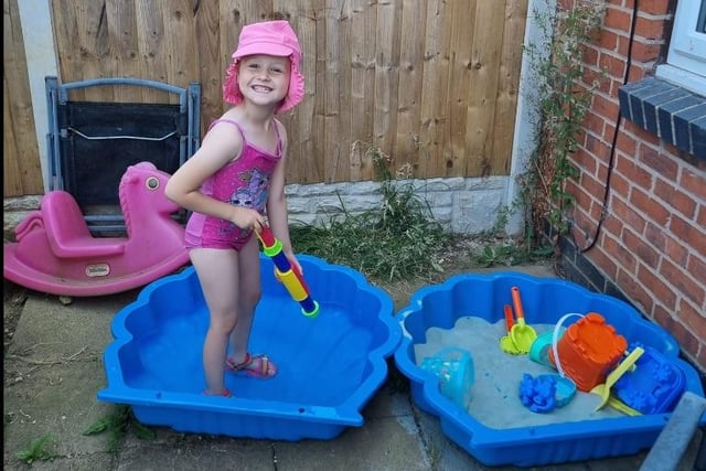 Jodie Shanice writes: "My daughter Ellia playing in her paddling pool."