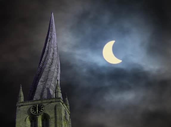 Crooked spire in the moonlight.