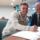 Matlock Town skipper John Johnston has signed on again for the new season.