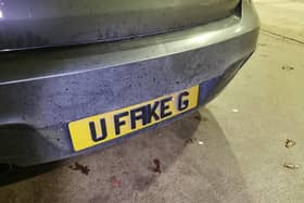 Close up of the "U Fake G" number plate