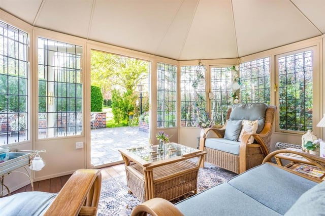 The stunning garden room provides panoramic views of the grounds through stone mullioned windows. The room has underfloor heating, a large light lantern above and patio doors leading out onto a paved area and the rear lawn.