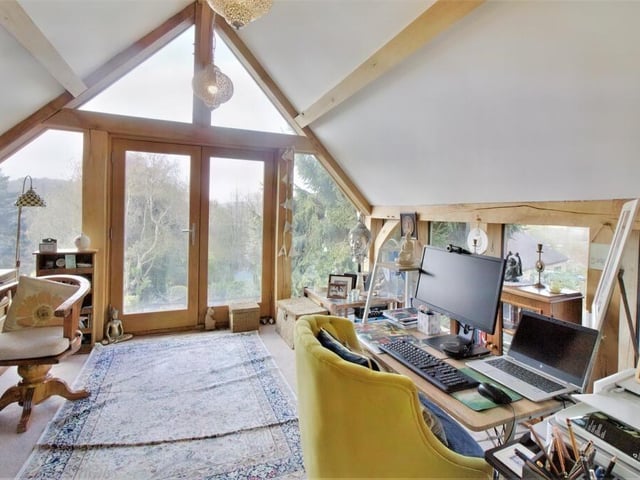 Stunning A frame windows flank the French doors opening to the balcony from where there are far-reaching views towards Riber Castle.