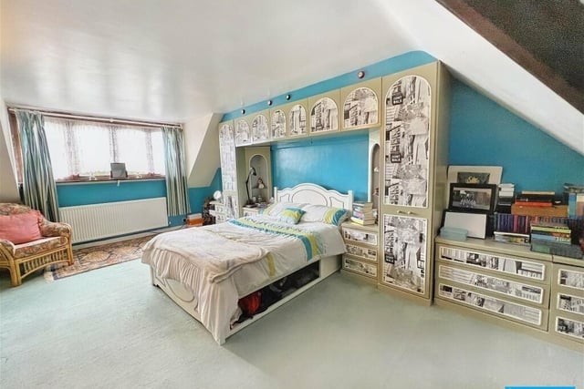Built into the curvature of the roof, this room has a restricted head height entrance. The bedroom has built-in wardobes and drawers surrounding the space for the bed as well as integrated bedside tables and open display shelving.
