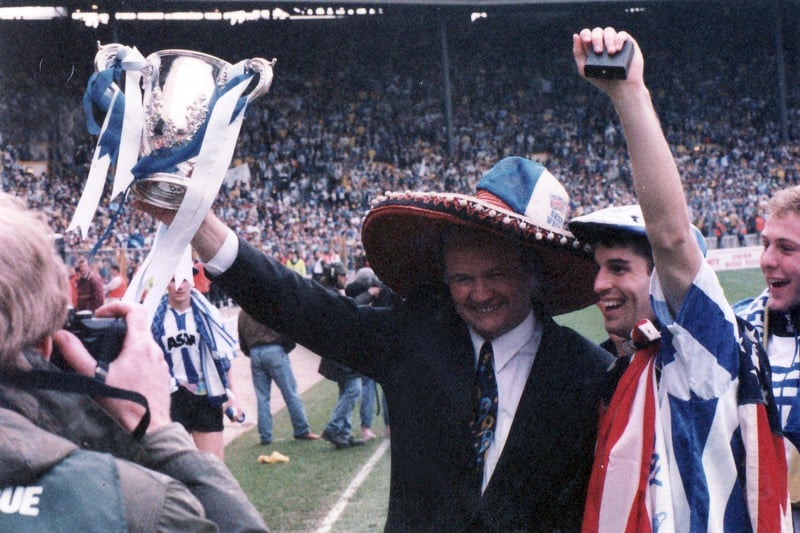Ron Atkinson with the cup alongside US star John Harkes.