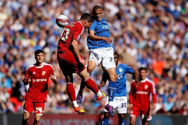 Jordan Bowery (R) wins a header against Oliver Risser during the Johnstone's Paint trophy Final between Swindon Town and Chesterfield at Wembley Stadium on March 25, 2012.
