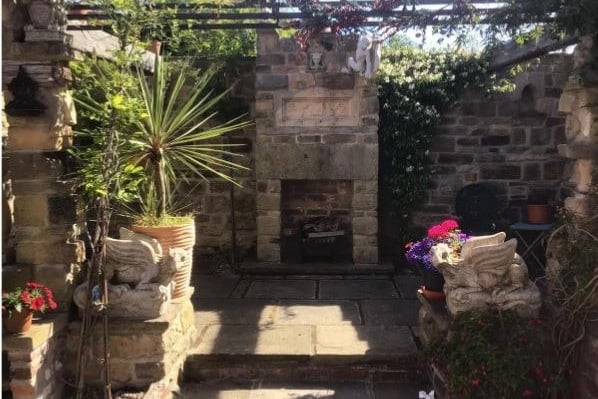Handmade stone fireplaces with working fires are in the gardens.