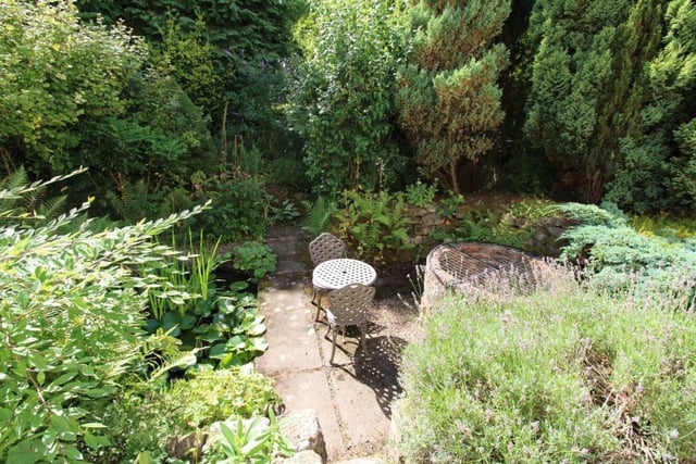 The garden, which stands in a plot of just over one-third of an acre, even features a covered well.