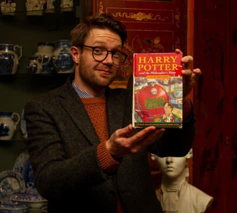 Jim Spencer with Harry Potter hardback first edition found in skip.