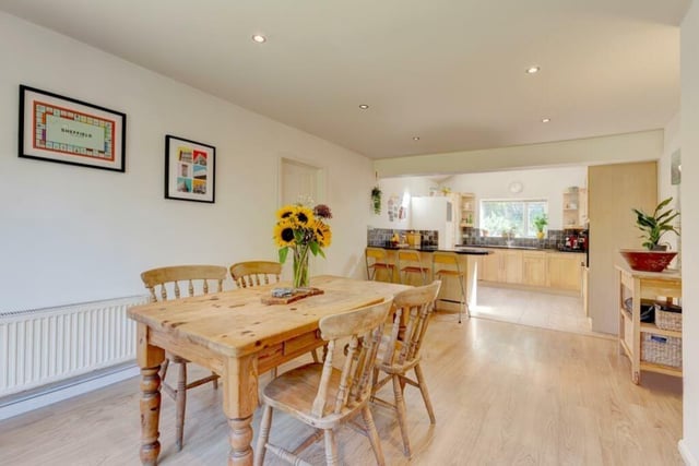 The open-plan dining kitchen gives a light and airy appearance to the heart of the home.
