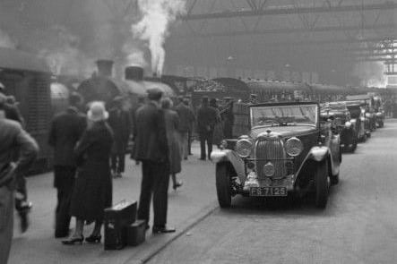 Long-lost Edinburgh Princes Street station, locally referred to as the ‘Caley’, makes an appearance in de Poll’s work. Period motorcars - evidence of the station’s Rutland Street vehicle access - can be seen lined up as a plume of white steam rises from one of the waiting locomotives.