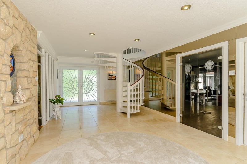 The property opens into this beautiful room with a spiral staircase to the first floor