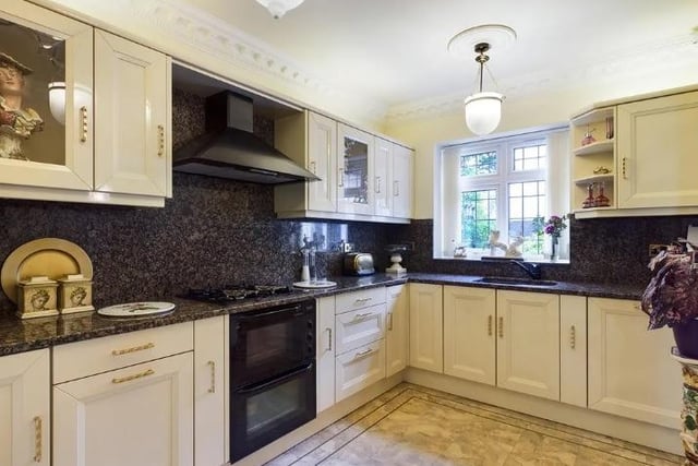 The kitchen has a good range of wall and floor storage units incorporating the oven with cooker hood over and sink with contrasting work surfaces. A utility room serves the kitchen.