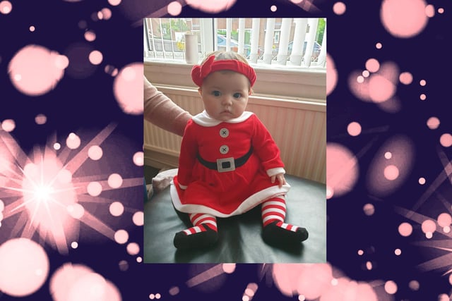 Five-month-old Jasmine in her Mrs Claus frock.