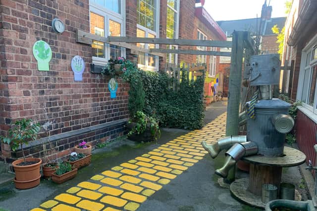 The painted courtyard area at Cavendish Junior School which now resembles the Yellow Brick Road from the classic novel The Wizard of Oz
