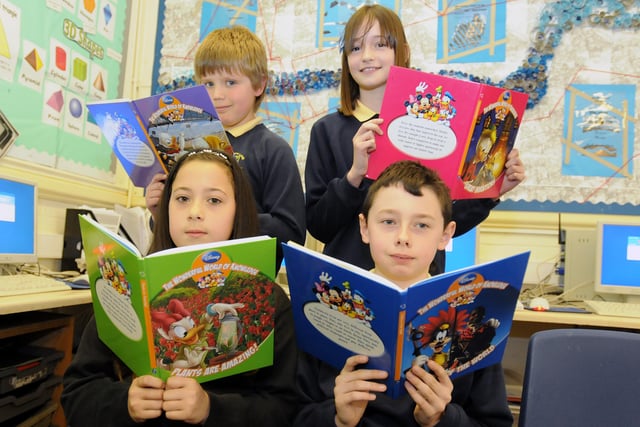 Matthew Rawlings, Olivia Foster, Alix Wagner and Thomas Harding can't get enough of their Disney read at Hedworth Primary in 2011.