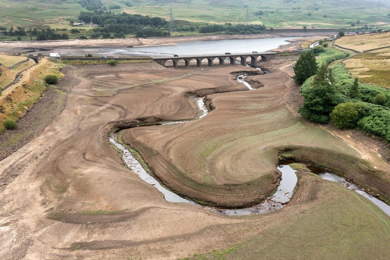 In this aerial view the bed of the Woodhead reservoir can be seen as summer water levels become reduced in July 2022. High demand for drinking water, record temperatures and reduced rainfall saw some reservoirs in England at only 62% capacity.