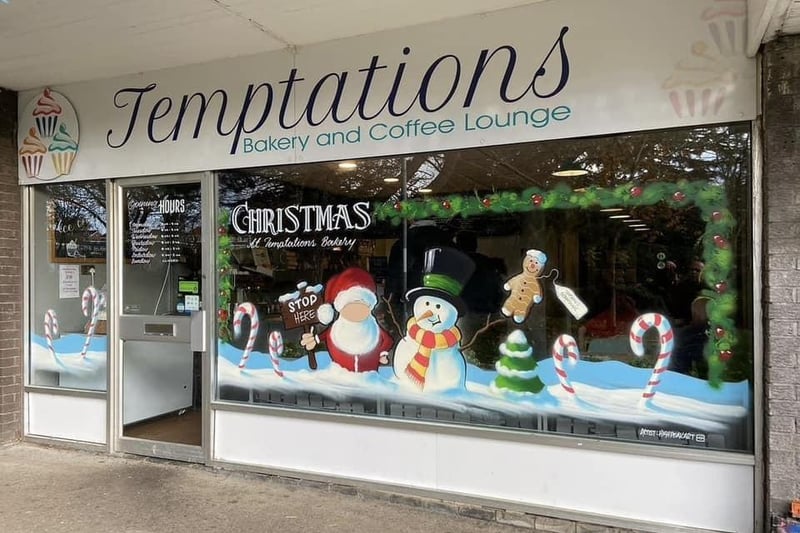 A full festive window including Santa, snow man and candy canes for Temptations Bakery & Coffee Lounge Limited in Dronfield Woodhouse.